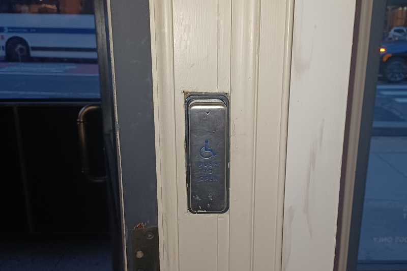 Push button to open the door for disabled guests