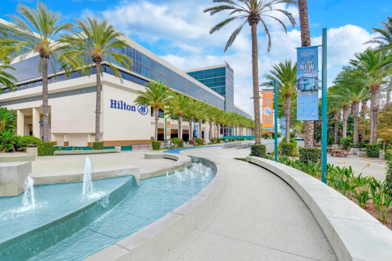 Pool with water works and palm trees