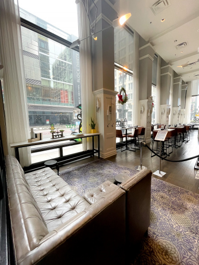 Lobby with floor-to-ceiling windows and a sofa