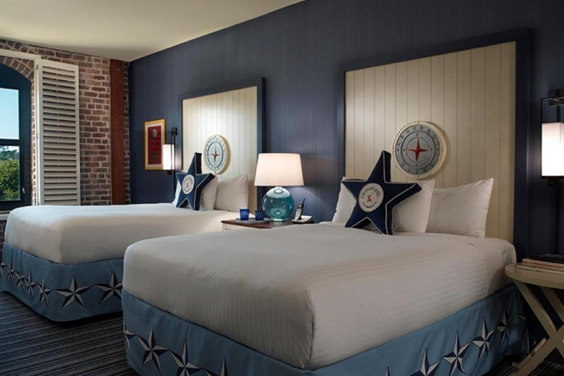 Guestroom with modern decor and beds
