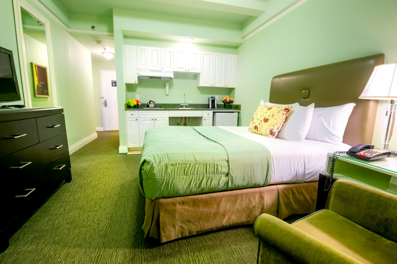 Guestroom with bed and seating area.