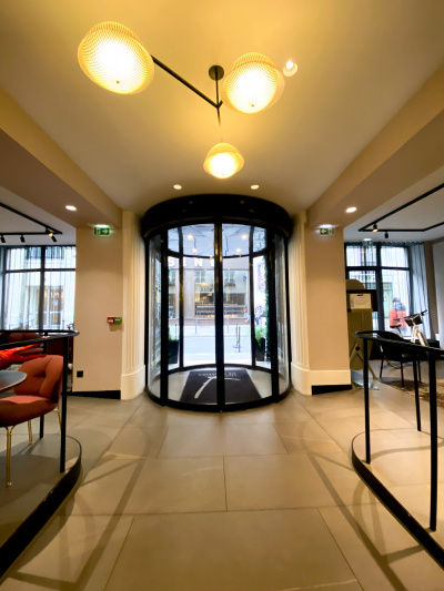 Circular lobby entrance with accessible, wide double doors