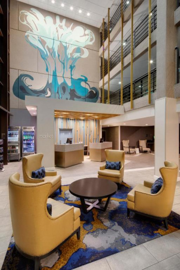 Lobby with seating area and mini market