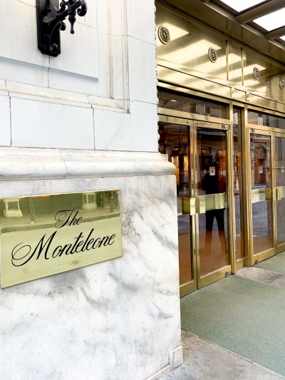 Hotel entrance with double doors and marble detailing