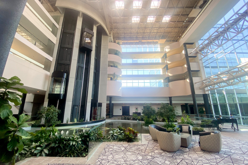 Lobby area with pond and seating area