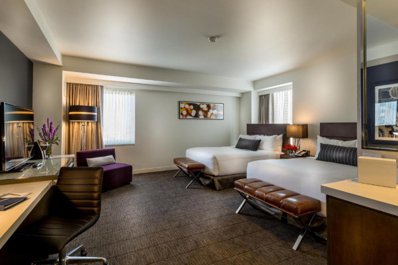 Guestroom with stylish decor and two beds