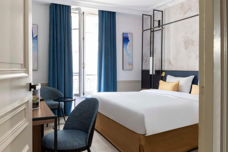 Guestroom with modern decor and artwork