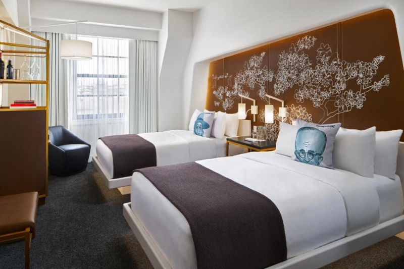 Guestroom with designer decor and two beds