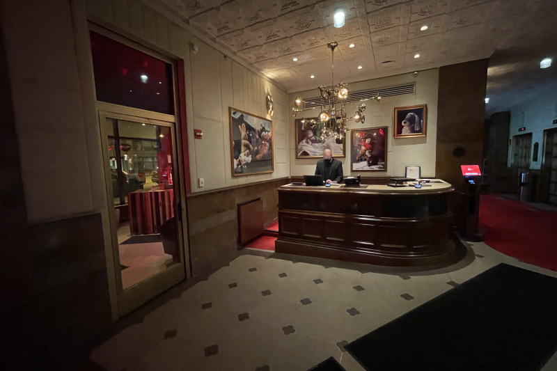 Front desk with tiled flooring and modern art
