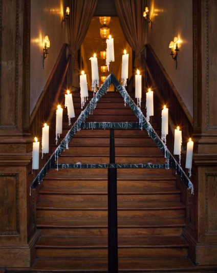 Lobby with wooden staircase and candle bridge