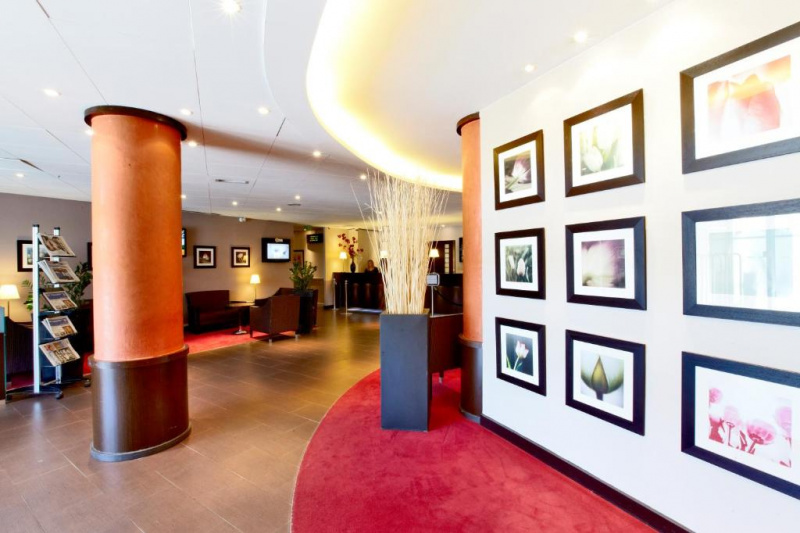 Lobby with seating area and newspaper stand