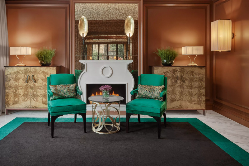 Lobby seating area with armchairs and fireplace
