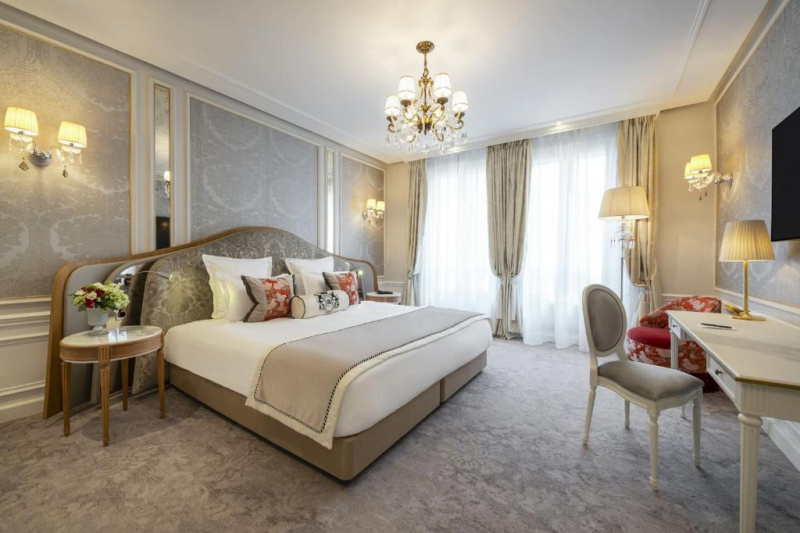 Guestroom with luxurious decor and chandelier