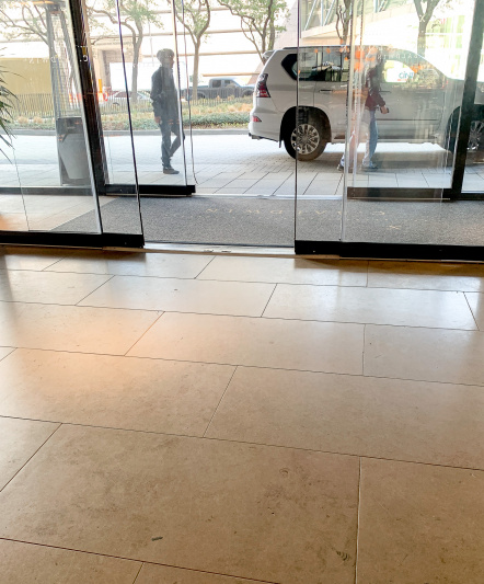 There are two sets of automatic, glass, double doors that lead from the drive-up entrance.
