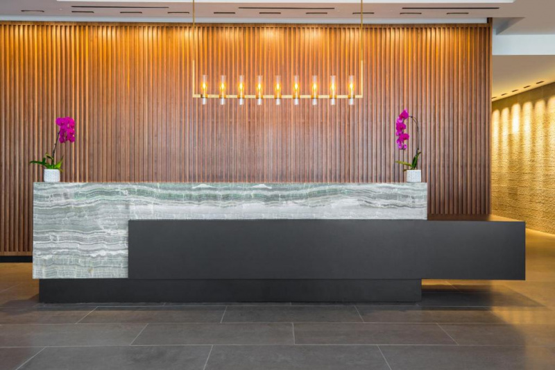 Access to the reception desk is step-free. The desk has a lowered section to one side.