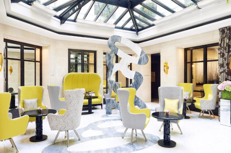 The hotel lobby, with smooth floors and groups of armchairs