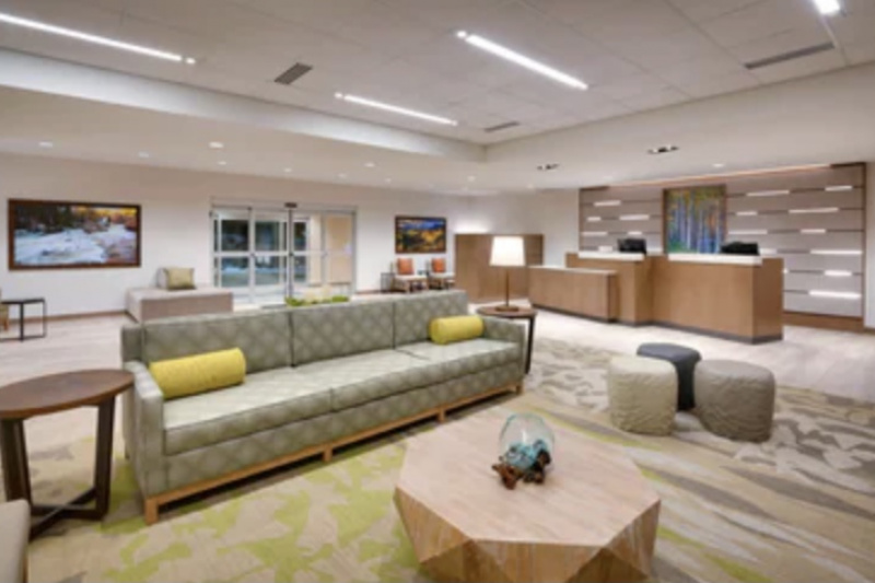 Entrance lobby with step-free access, low and high level reception desk and comfortable seating.