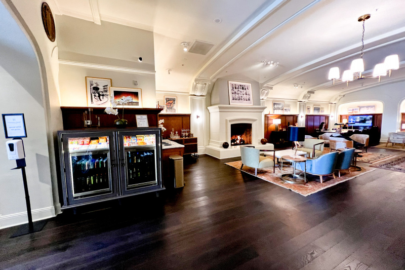 The hotel lobby has accessible snacks, comfortable seating and a fireplace.
