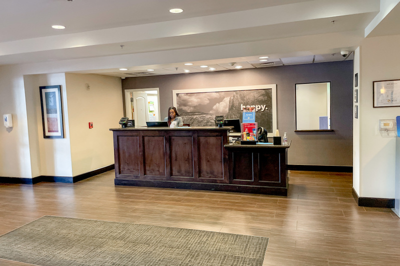The reception desk has a lowered counter section for wheelchair access.