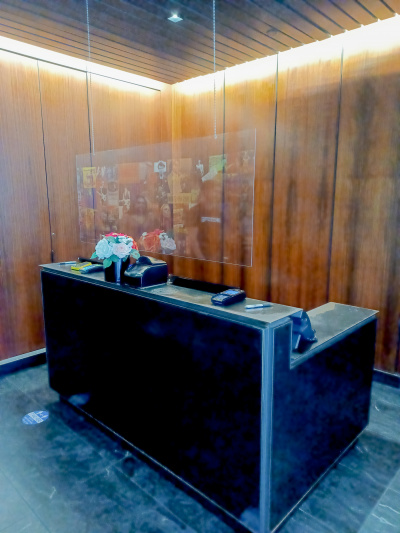 The reception area is bright and modern with a lowered counter section for wheelchair access.