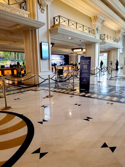 The reception area is very large, with a cordoned-off queueing system to get to the high reception desks.