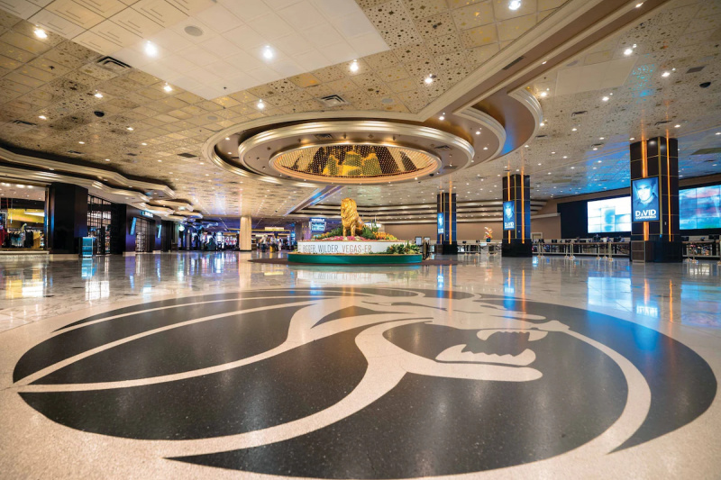 The vast lobby has a smooth marble floor and a statue of the MGM lion.
