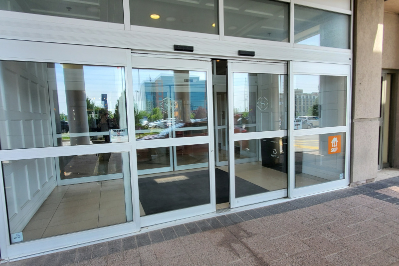 The hotel entrance has automatic sliding doors.
