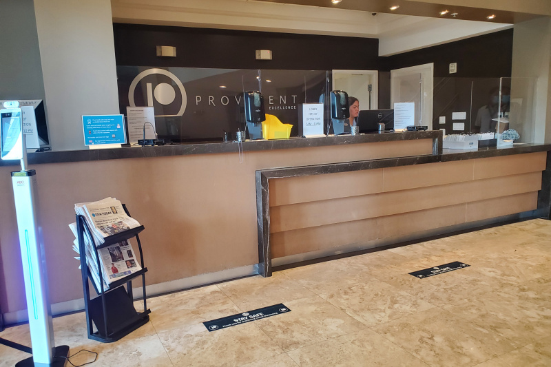 The reception desk has a lowered counter section for wheelchair access and free newspapers are available.