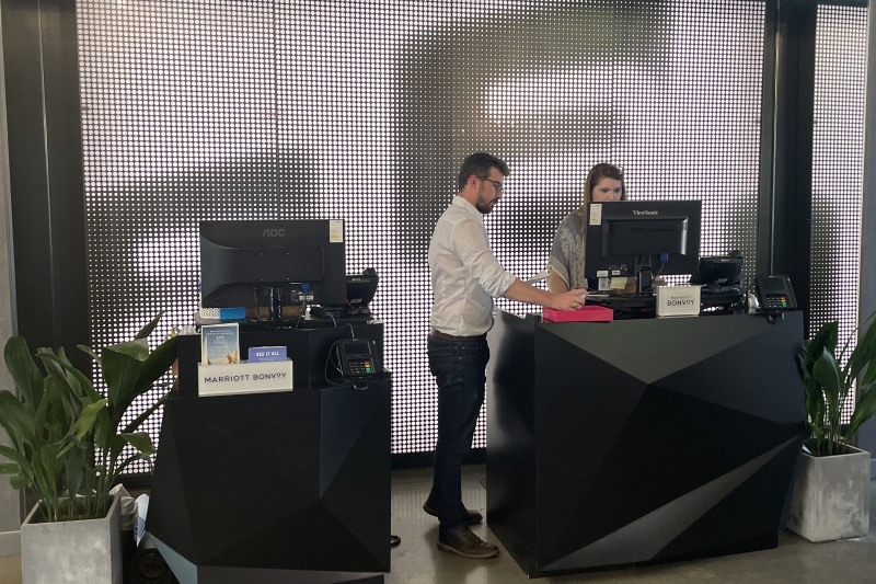The reception desk has a lowered counter and card machine for wheelchair access.
