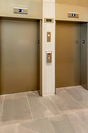 There are 2 accessible elevators with low buttons.