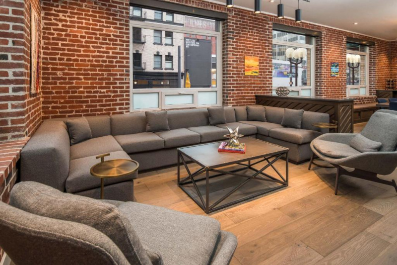 The spacious hotel seating area has built-in sofas and moveable chairs and coffee tables.