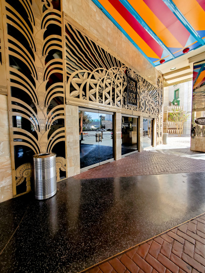 The accessible hotel entrance has two large glass doors.