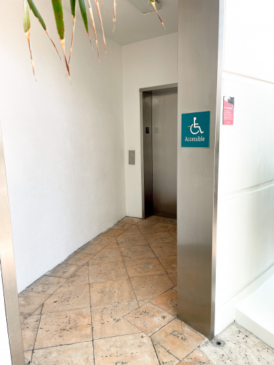 There is an accessible lift with low call buttons.