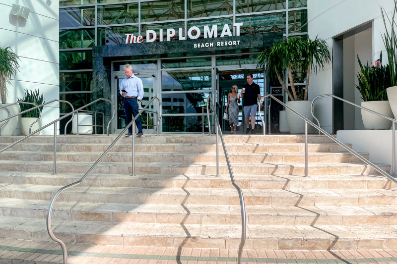 The hotel has a wide flight of 8 steps with well-spaced handrails leading up to the entrance.