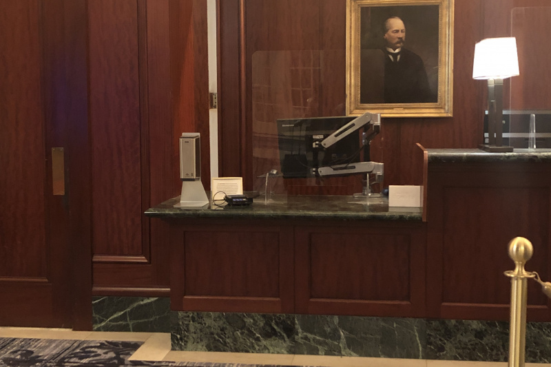 The carpeted reception desk has a lowered section.