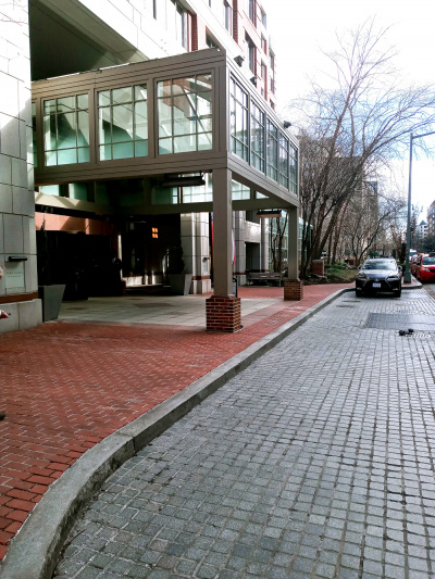 There is a drive-up entrance to the hotel, with a curb to get on the hotel sidewalk.
