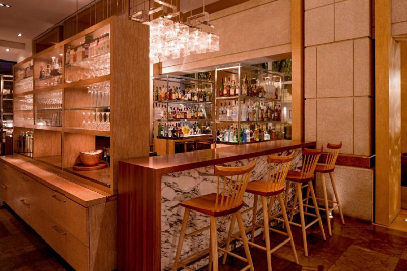 The spacious well-stocked bar has a high counter with 4 bar stools.