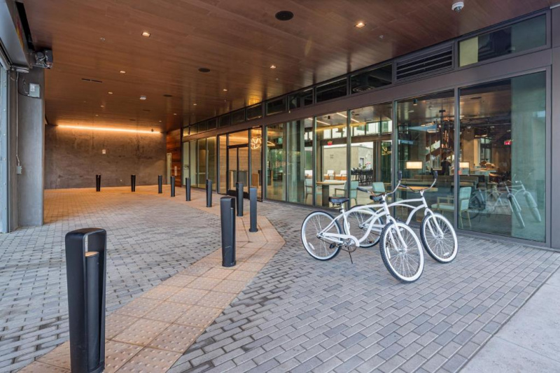 There is a drive-up entrance to the hotel and a series or doors to enter the hotel.