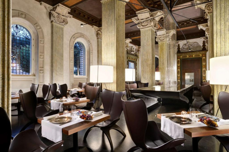 The elegant dining area has modern furnishings. There is very little space to move around.