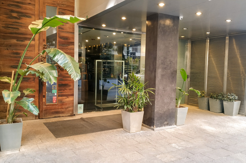 The step free entrance to the hotel is through a large glass door.