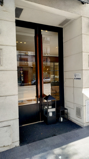 The step-free entrance is through a tall, glass door.