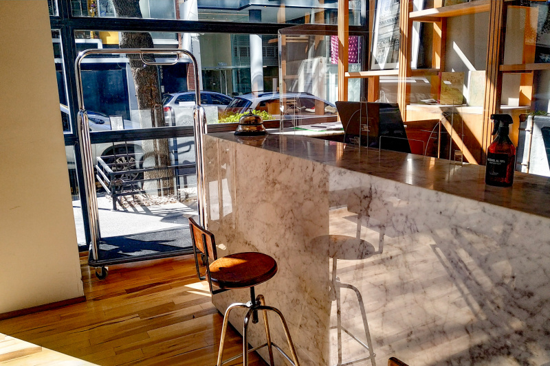The step-free reception area has a high check-in with a stool.