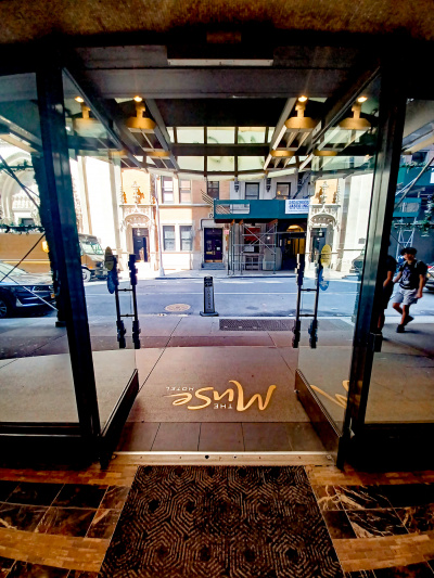 The hotel exit is through 2 glass doors. It is step-free and leads onto the sidewalk.
