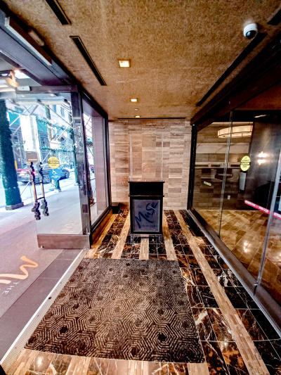 Access to the hotel is through 2 sets of automatic glass doors.