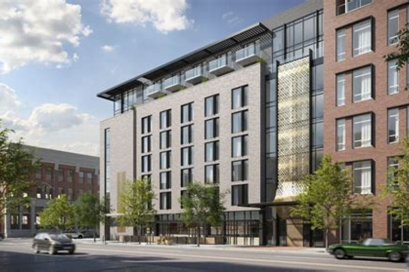 An exterior view of the 6-storey hotel. The entrance to the hotel is from the sidewalk.