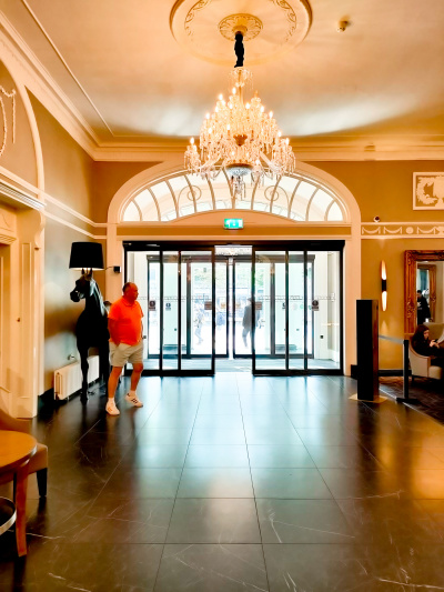 The hotel exit is through 2 sets of large automatic, glass doors. The lobby is wide and step-free.