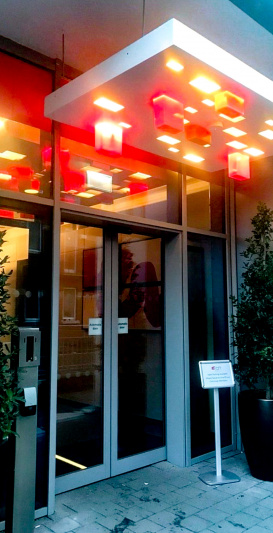 Access to the hotel is through 2 glass sliding doors.