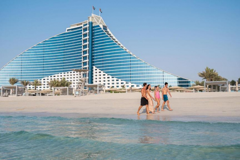 An exterior view of the hotel from the sea.