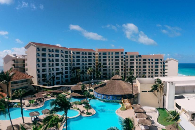 An aerial view of the hotel and pool complex.