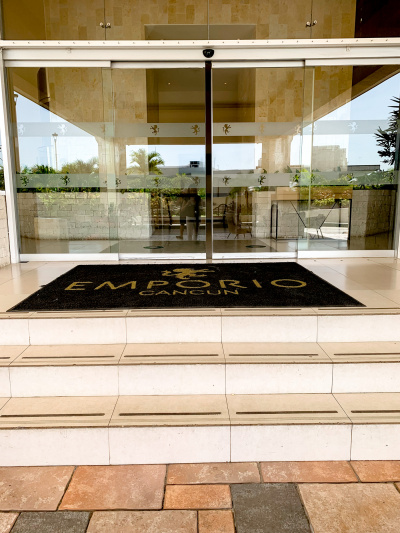 Access to the hotel is through 2 glass sliding doors. There are 3 steps leading up to the doors from the sidewalk.
